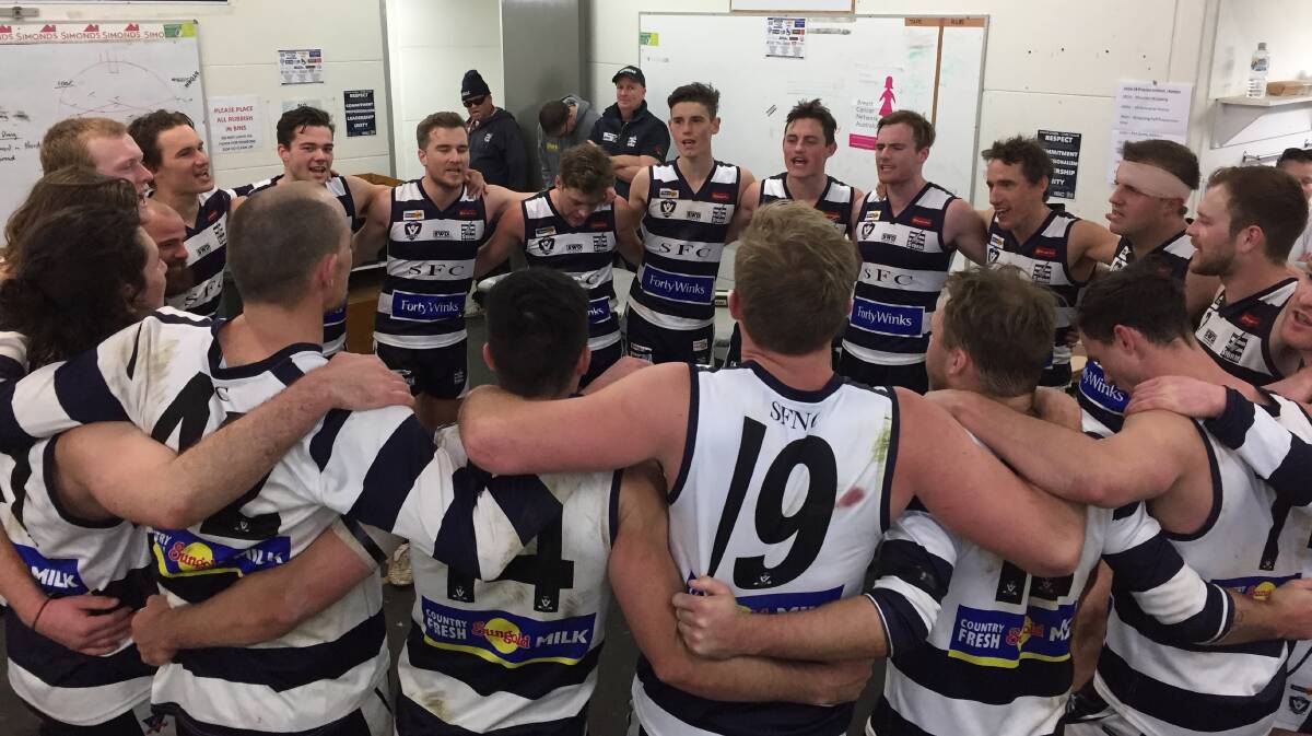 VICTORIOUS: Strathfieldsaye players belt out the team song following Saturday's 23-point victory over Kyneton at Tannery Lane. The Storm are now two games clear at the top of the ladder. Kyneton dropped out of the top three as a consequence of the defeat. Picture: LUKE WEST