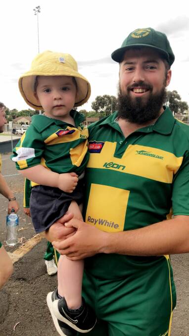 Brent Hamblin with his son Karter after his 11 wickets over the weekend.