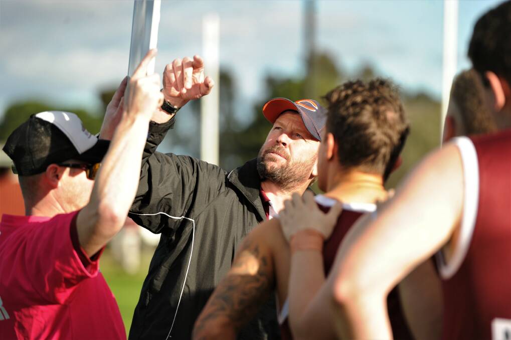 SEASON RE-START: Newbridge coach Luke Freeman addresses his players at quarter-time against Calivil United last Saturday. It had been 35 days since the Maroons' previous game against Inglewood in the Loddon Valley Football-Netball League. Picture: ADAM BOURKE