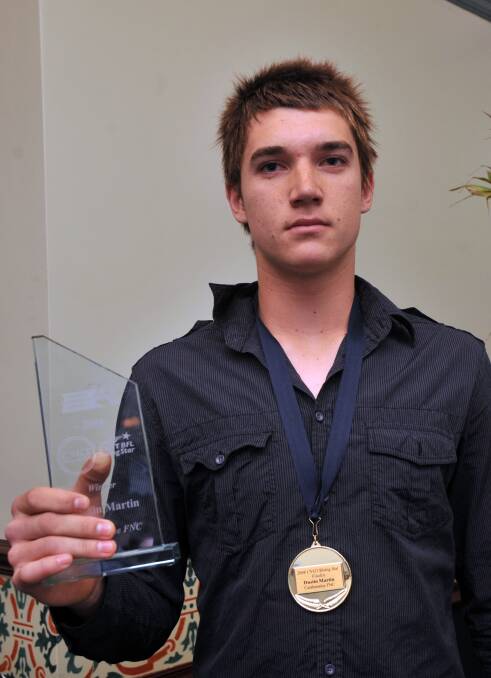 Dustin Martin with his BFNL Rising Star Award trophy in 2008.