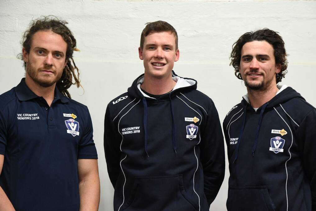 Jack Geary, Andrew Collins and Adam Baird ahead of playing for Victoria Country, coached by Danny Frawley, in 2018.