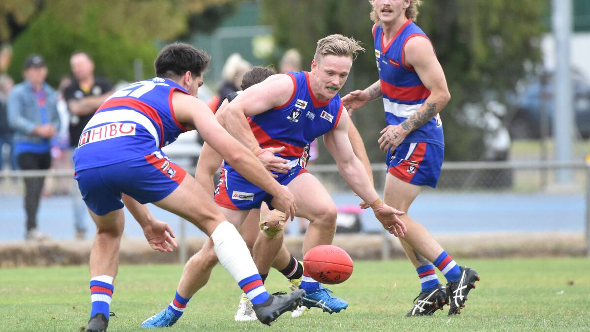 EYES ON THE BALL: North Bendigo midfielder Nathan Newlan gets ready to pounce on the ball against Heathcote on Saturday. Picture: NONI HYETT