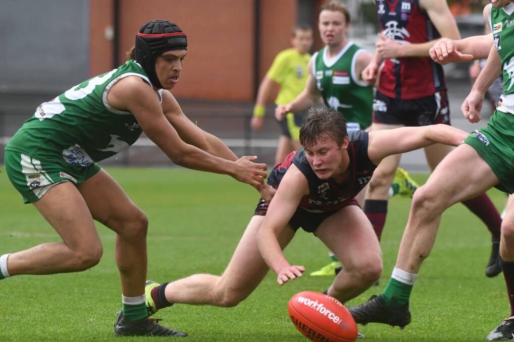 FOOTY FUTURE: Action from this year's under-18 Bendigo league grand final between Kangaroo Flat and Sandhurst at the QEO last month. All age groups in the region will remain as is for next year. Picture: NONI HYETT