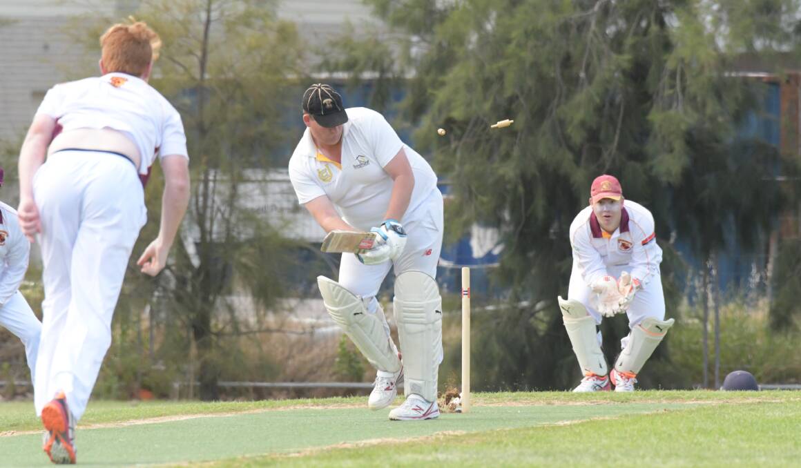 MIDDLE PEG KNOCKED OUT: United batsman Alex Collins is bowled for a golden duck by Maiden Gully's Mitchell Van Poppel at Ewing Park on Saturday. The Tigers were dismissed for 194, but have the Lions under pressure at 5-40 in reply. Pictures: NONI HYETT
