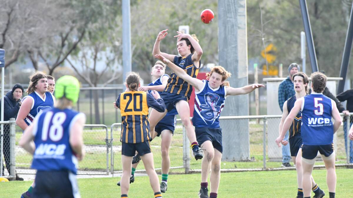 CONTEST: Action from Thursday's match between Catherine McAuley College and Weeroona College. Pictures: NONI HYETT