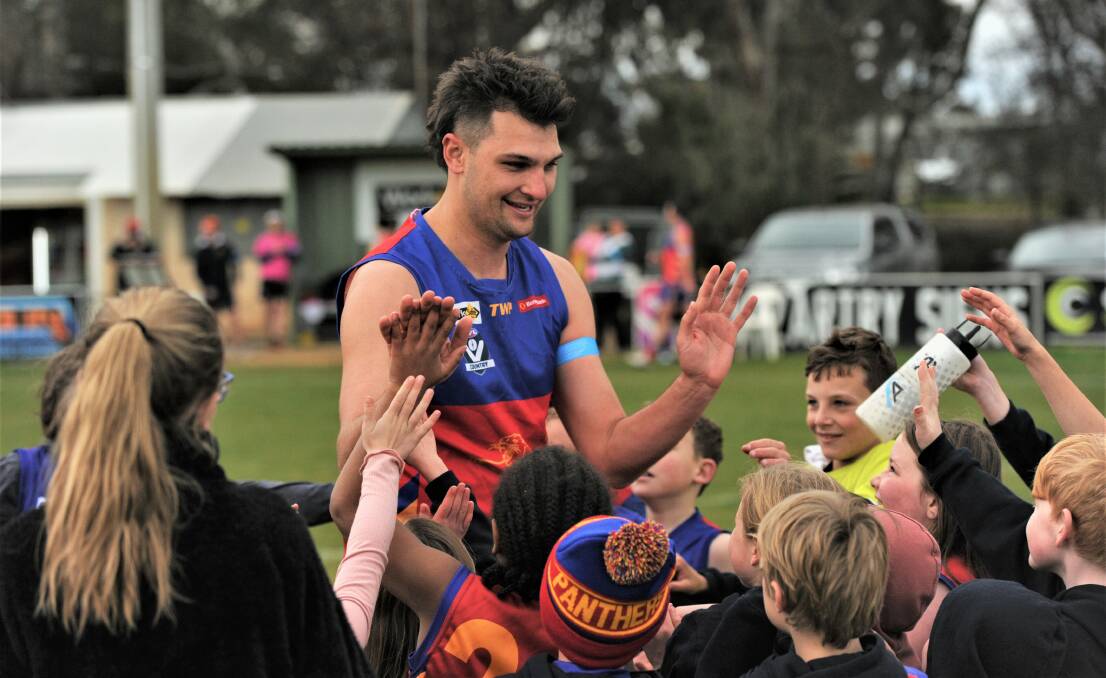 Brandyn Grenfell high fives his young Marong fans after kicking his 100th goal for the season on Saturday. Picture: ANTHONY PINDA