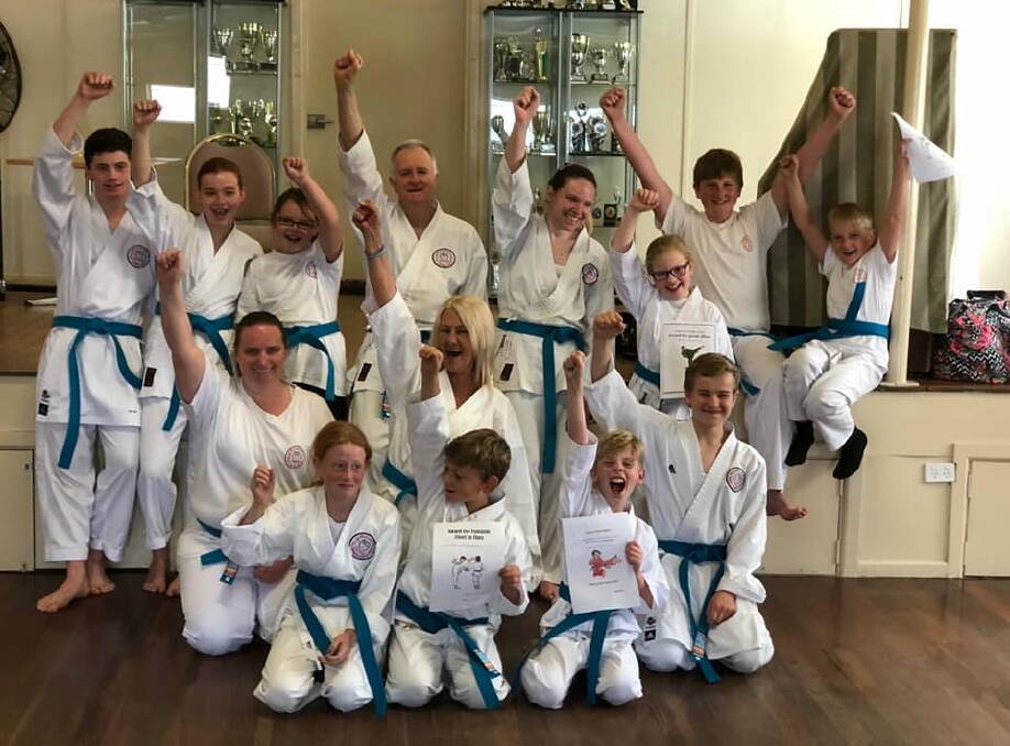 RAISING AWARENESS: Members of Bendigo's GKR Karate Club with their blue belts as part of the Blue Belt Project during October.
