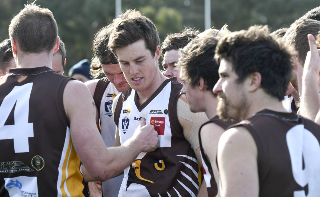 Huntly players listen to coach Stacy Fiske. Picture: NONI HYETT