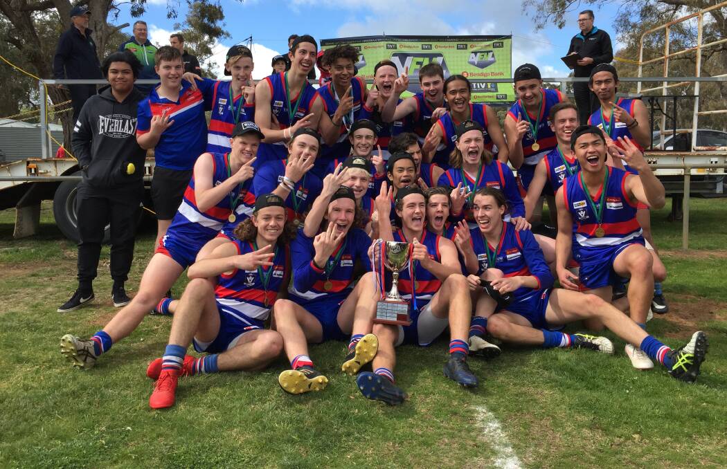 THREE IN A ROW: Pyramid Hill celebrates a third-consecutive under-18 flag on Saturday. The Bulldogs defeated the previously unbeaten Maiden Gully YCW by nine points in a low-scoring game at Calivil. Picture: LUKE WEST