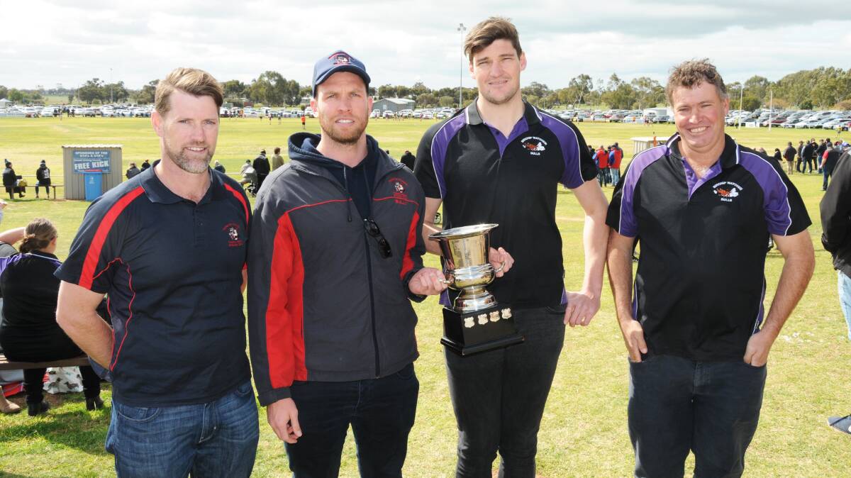 ULTIMATE PRIZE: Wycheproof-Narraport president Josh White and coach Julian Bull and Birchip-Watchem coach Lochlan Sirett and president Jim Sheahan with the NCFL Halfhide Cup. Picture: SHANE O'SHEA, BULOKE TIMES