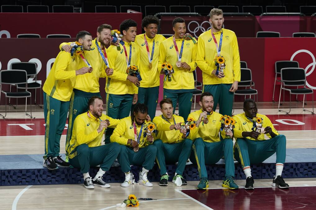 The Boomers after winning bronze on Saturday night. Picture: AP Photo, Charlie Neibergall