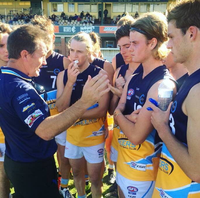 KEY MESSAGES: Bendigo Pioneers' coach Rick Coburn speaks to his players at quarter-time, at which stage the Northern Knights were 26 points in front on Sunday. Picture: BENDIGO PIONEERS FACEBOOK PAGE