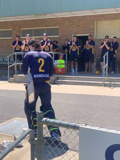 Team-mates applaud James Barri after his century on Monday. Picture by Travis Harling