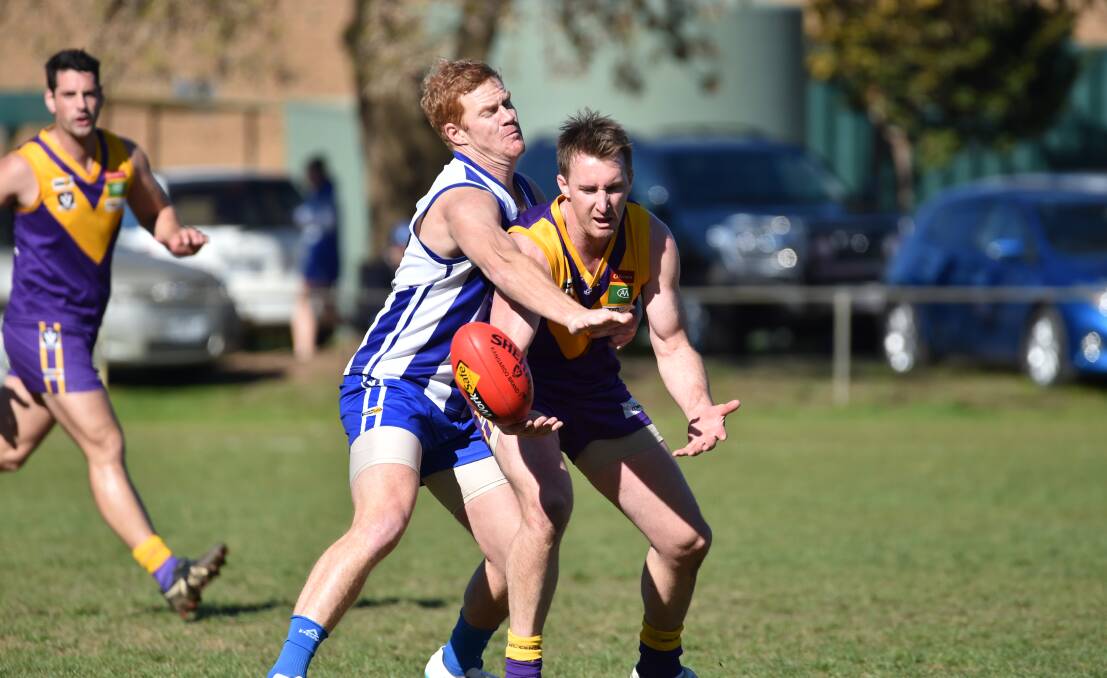 CONTEST: Mitiamo's Tim Brooks and Bears Lagoon-Serpentine's Andrew Gladman compete for possession during Saturday's Loddon Valley league qualifying final at Marong. The Superoos won by 49 points after breaking the game open in the last quarter. Picture: GLENN DANIELS