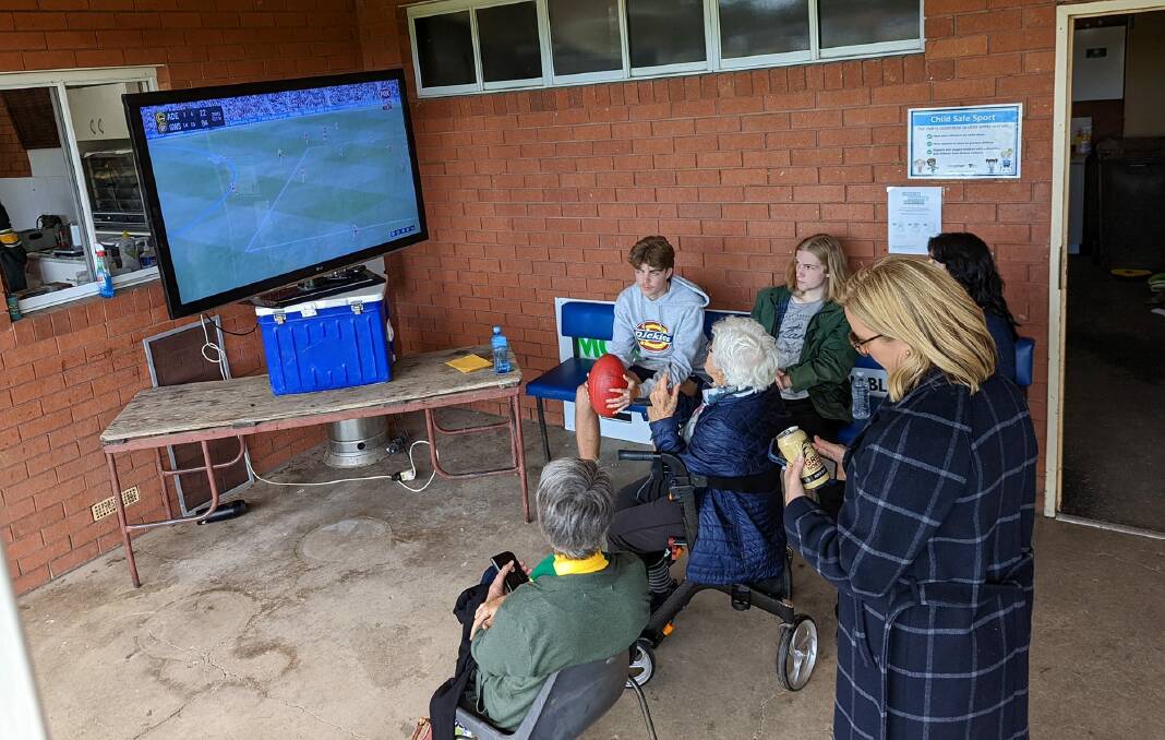 SPECIAL DAY: A group of Colbinabbin supporters watch local Cooper Hamilton's AFL debut on Saturday afternoon for the GWS Giants against Adelaide.