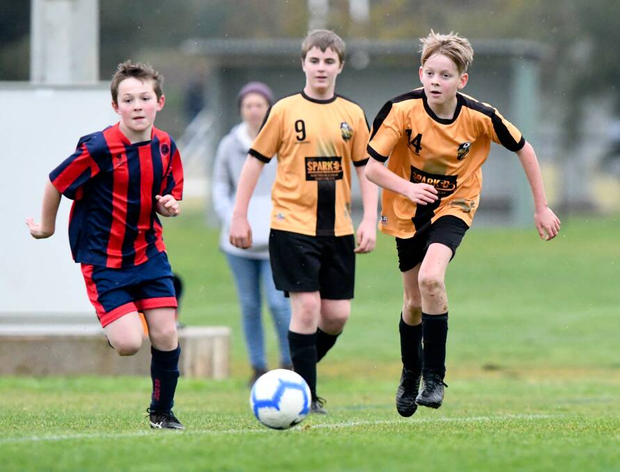 EXCITED TO BE BACK: Action from the BASL's Under-12C game between Epsom Strikers and Colts United Gold on Saturday. The Strikers won 10-2. Picture: NONI HYETT