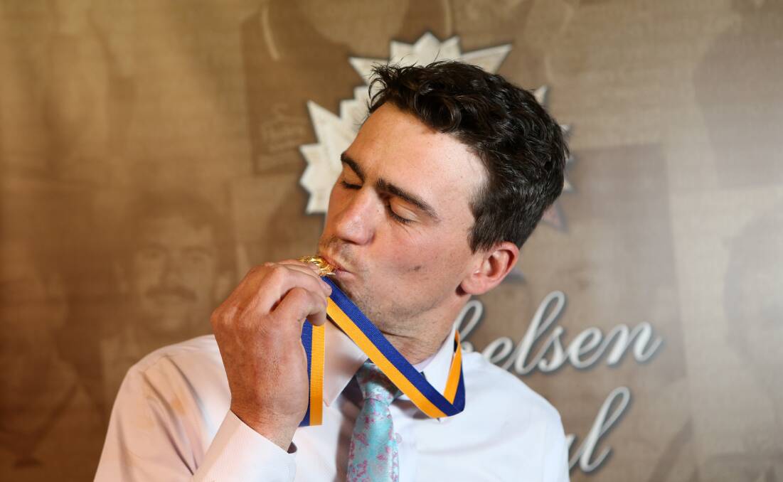 SEALED WITH A KISS: After finishing runner-up last season, Golden Square's Adam Baird won this year's Michelsen Medal with 16 votes. Picture: NONI HYETT