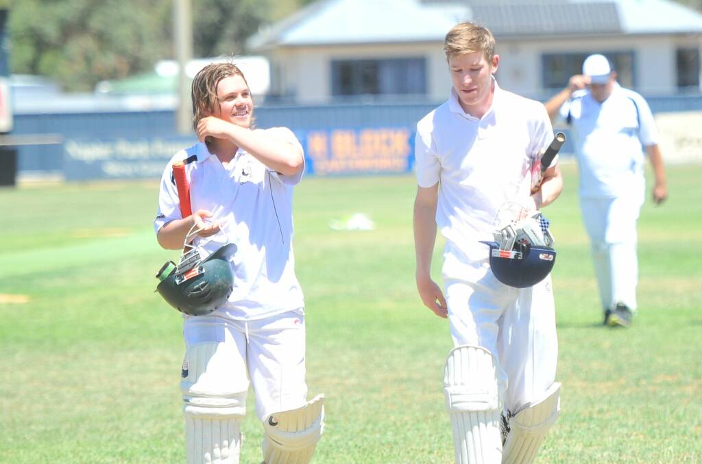 TOUGH DAY: Boort-Yando's William Gould and Simon Eicher head to drinks on Saturday. Picture: LUKE WEST