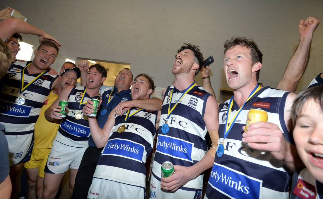 HOW SWEET IT IS: Strathfieldsaye players belt out their club song after their 2014 grand final win over Sandhurst that capped a 19-1 season.