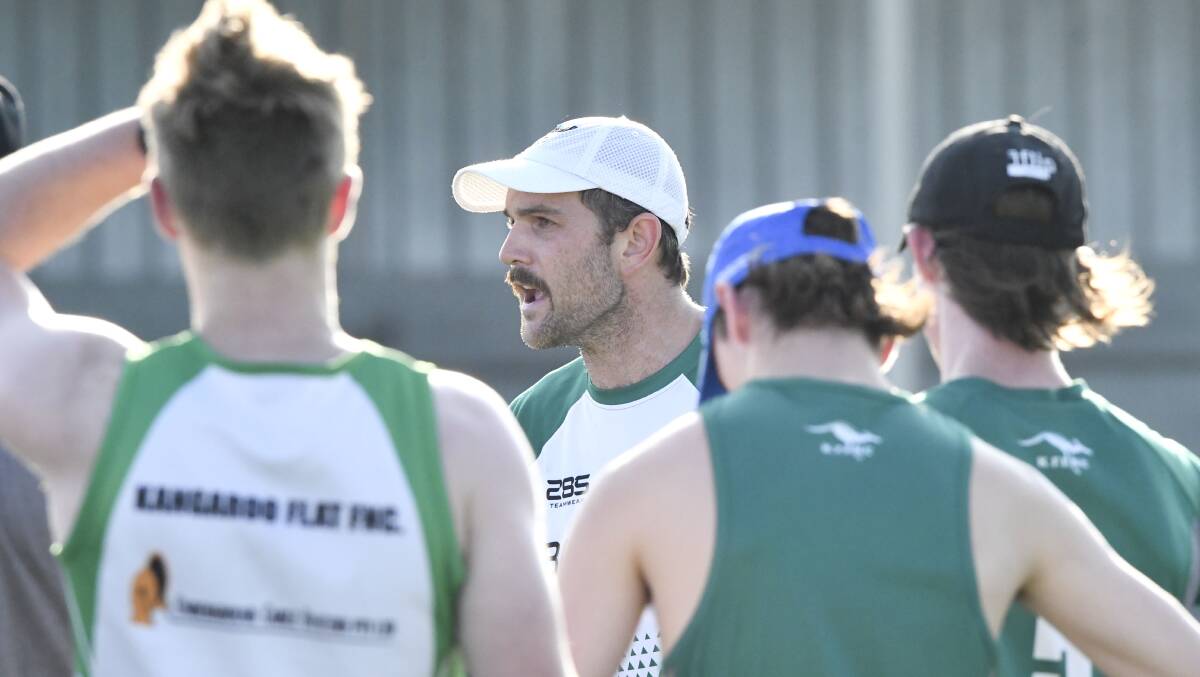 TRAINING ON HOLD: New Kangaroo Flat coach James Flaherty addresses his players at a Roos' pre-season training session earlier this year. Picture: ADAM BOURKE