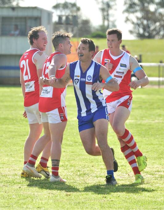 WINNERS ARE GRINNERS: Mitiamo's Kyle Patten likes the look of the scoreboard during Saturday's 41-point win over Bridgewater. Picture: ADAM BOURKE