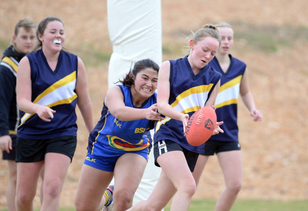 DETERMINED: Action from the Bendigo South East v Castlemaine Secondary College match during Wednesday's carnival. Picture: GLENN DANIELS