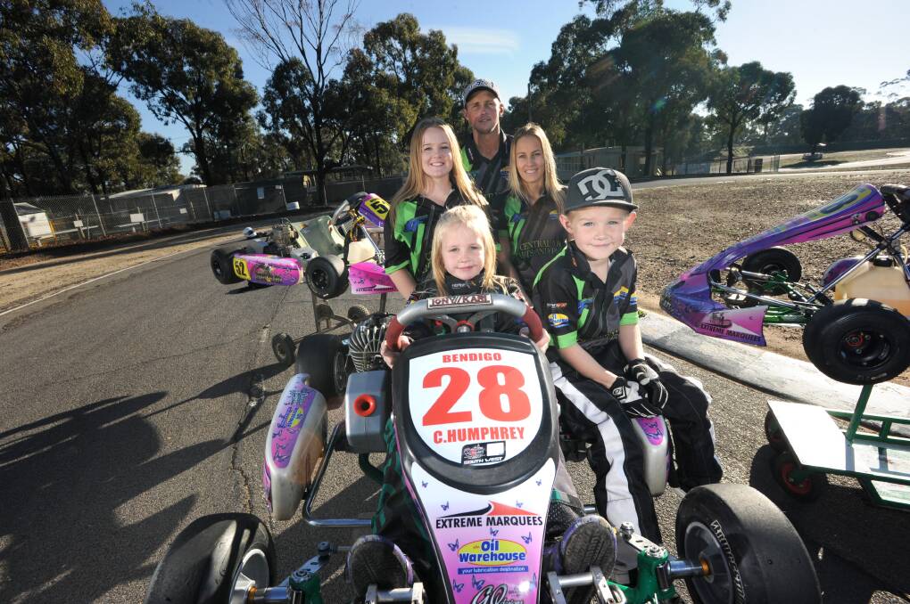 RECRUITING DRIVE: Phil Stradbrook, Jess Stradbrook, Kirsty Mullen, Chelsea Humphrey and Cayden Humphrey from the Bendigo Kart Club, which needs more members and volunteers. Picture: NONI HYETT
