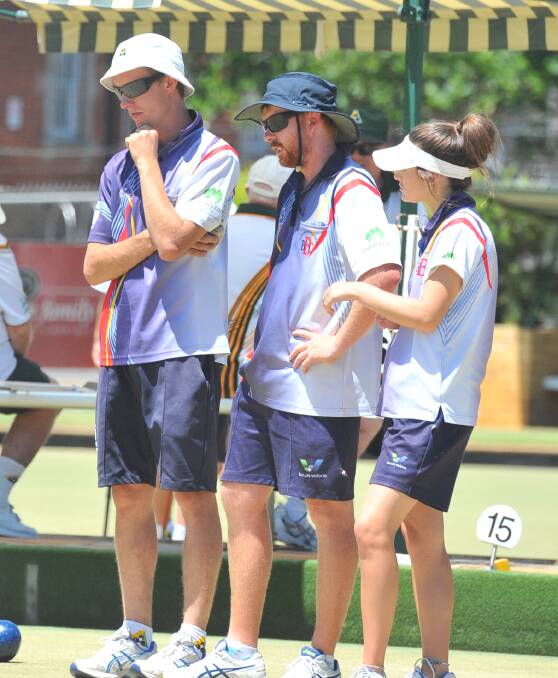 OBSERVING: Bendigo's Tim Arnold, Andrew Brown and Amelia Bruggy discuss the lay of the land in their match against the Golden Square rink of Trevor Schill.