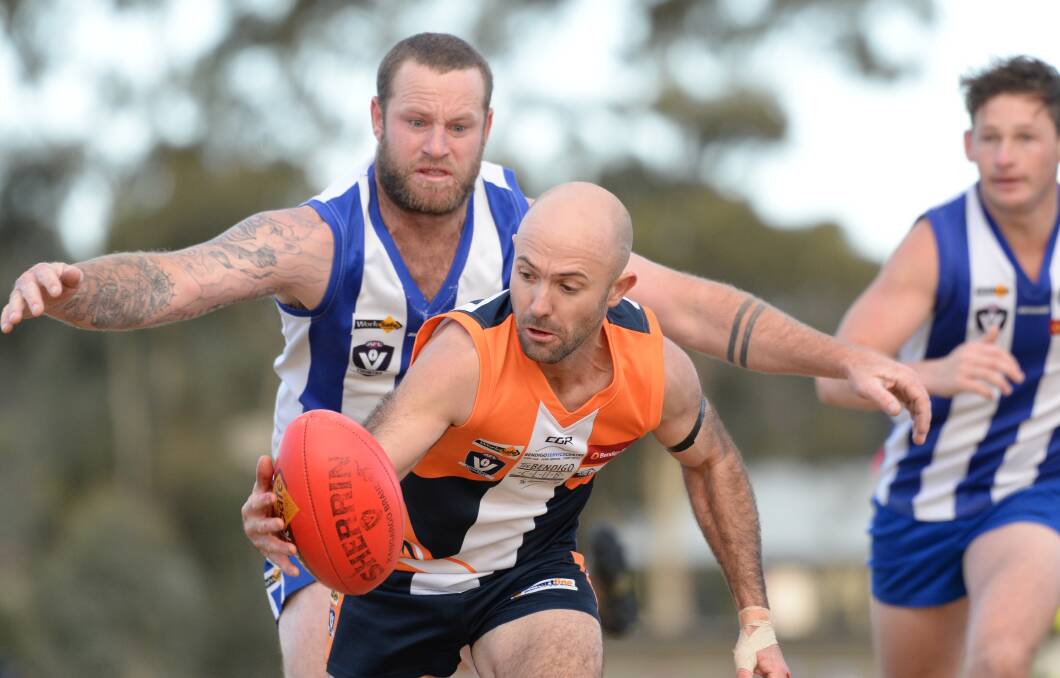 READY TO POUNCE: Mitiamo's Tom Grant gets ready to tackle Maiden Gully YCW's Joseph Coatsworth during the Superoos' 31-point win. Pictures: GLENN DANIELS