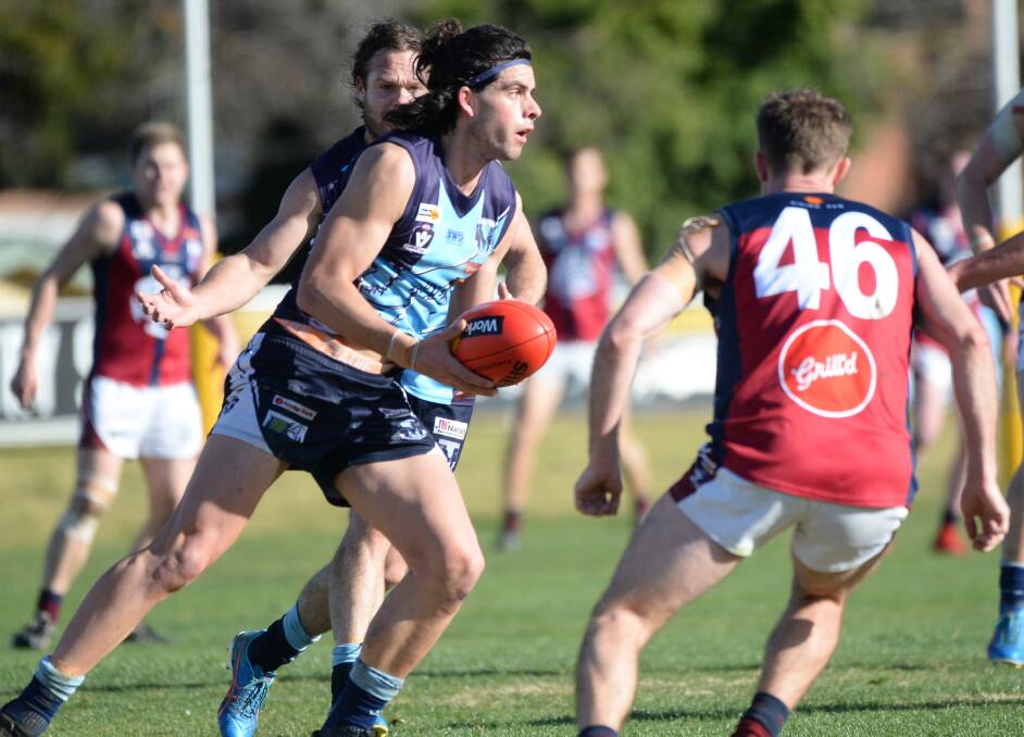 WELL PLAYED: Sam Harper was among Eaglehawk's best players in Saturday's hard-fought 17-point win over Sandhurst - a contest in which just 10 goals were kicked at Canterbury Park. The victory guarantees the Hawks the double chance. Picture: DARREN HOWE