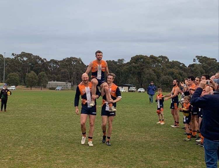Steve Turner is chaired from the ground after kicking six goals in the last quarter of his 300th senior game for Maiden Gully YCW on Saturday. Picture: MAIDEN GULLY FNC