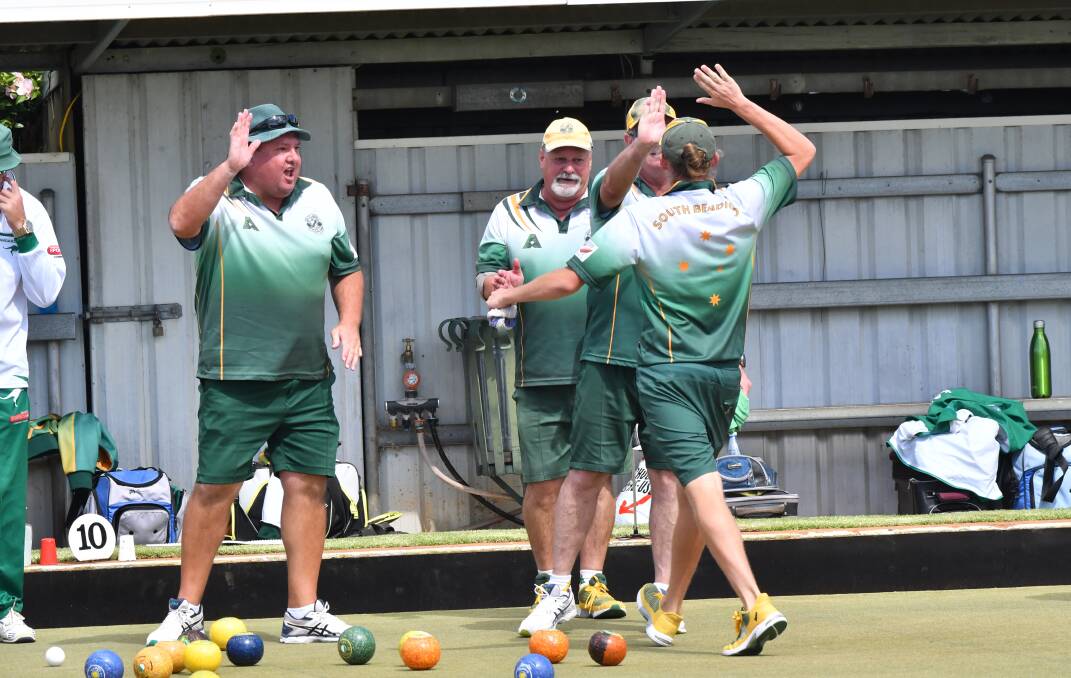 UP AND ABOUT: South Bendigo had plenty of reasons to high-five in Saturday's eight-shot grand final win over Kangaroo Flat. Picture: NONI HETT