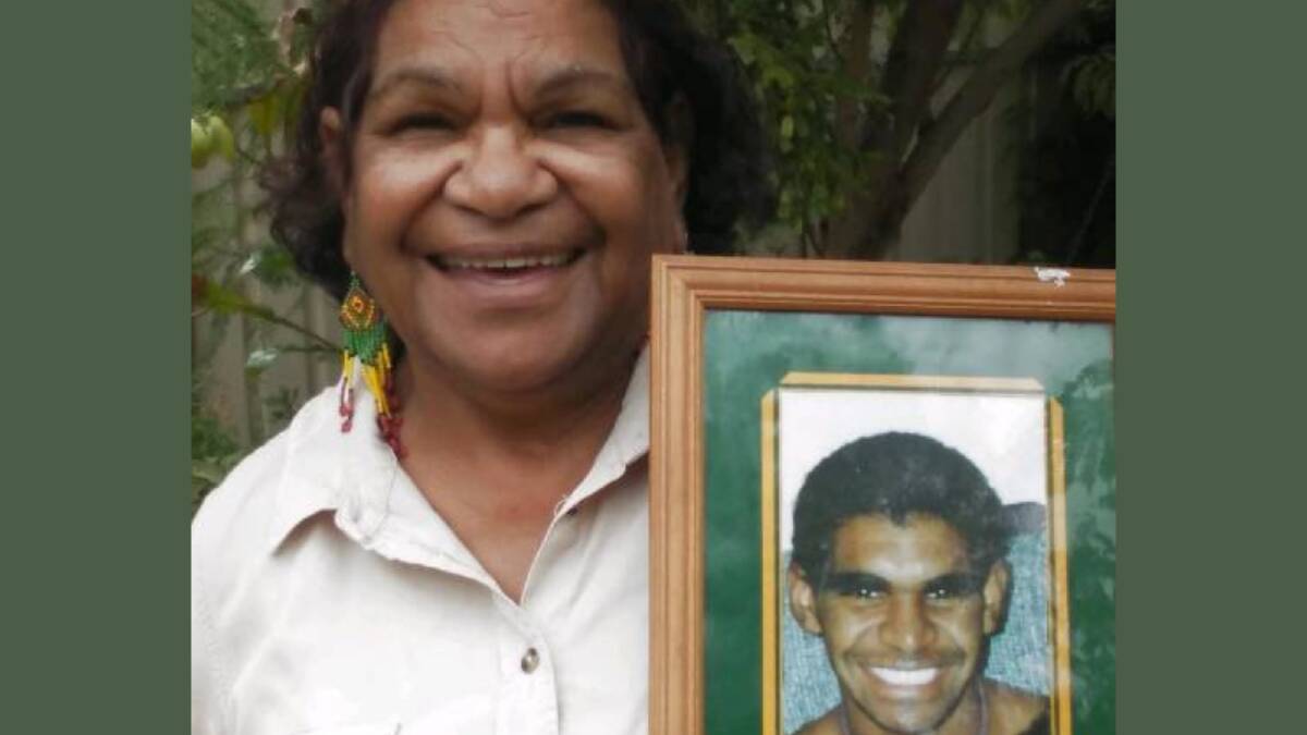 Cheryl Coulthard-Waye holds a picture of her son David who took his own life. She proposes a new way to combat indigenous suicide and sexual abuse.