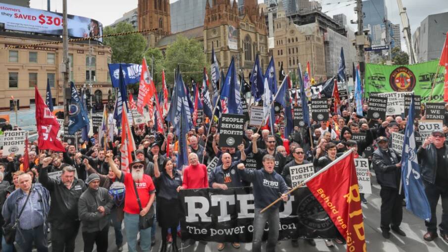 Rail workers rally outside of Flinders Street during bitter dispute with Metro for better pay. Photo: Jason South