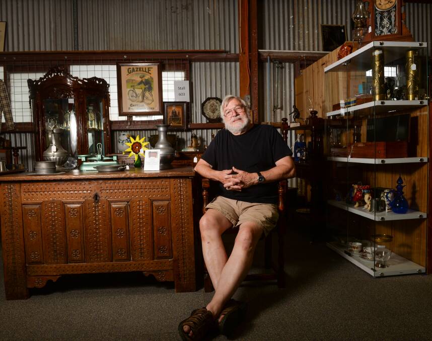 Busy: Eric Van der Wal ponders life from the environs of his stand at the Antiques Centre at Bendigo Pottery.