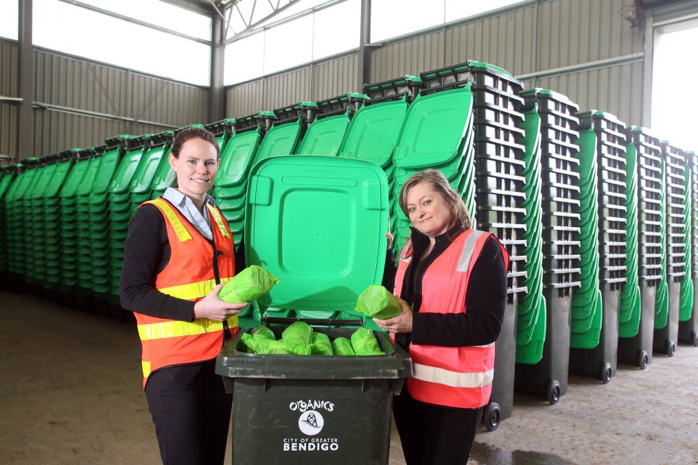 READY TO ROLL: Organics project officer Bridgette McDougall and waste services manager Natasza Purser with the new organic waste bins which will roll out from next week. Picture: GLENN DANIELS