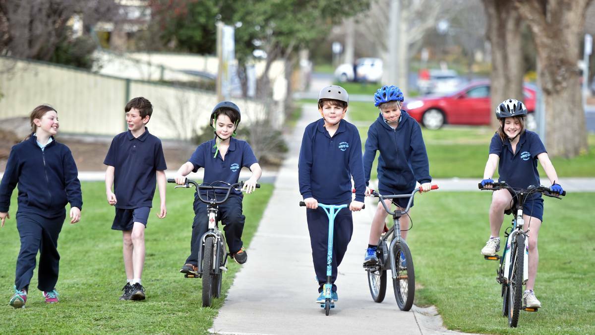 POSTER CHILDREN: Students at White Hills Primary School piloted a program which encourages them to walk, ride or scoot to school which will be rolled out across the city after council's endorsement of ITLUS in August 2015. Picture: JODIE WIEGARD
