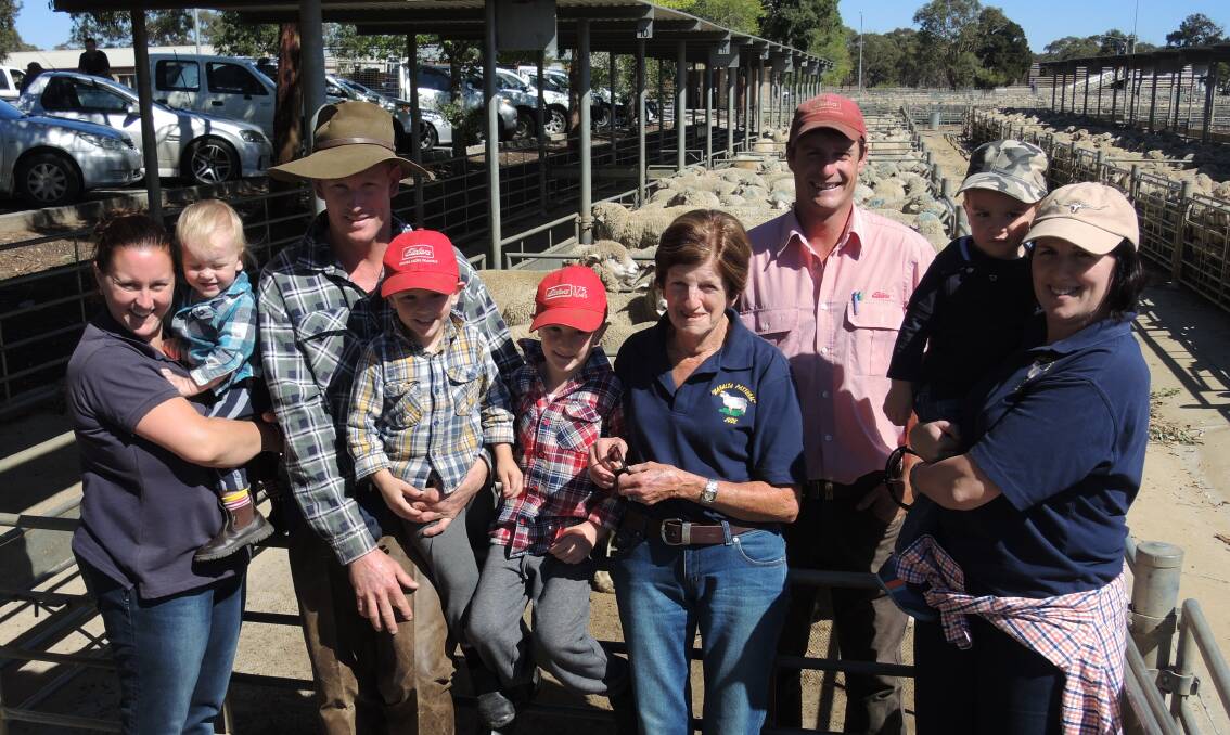 PITCHING IN: Katrina, Thomas, Billy, Heath, William and Judy Ogden, Nigel Starick and Sarah and Mitch Hansford at the Bendigo Livestock Exchange on Monday – the Ogdens raised $3500 for The Royal Children's Hospital. 