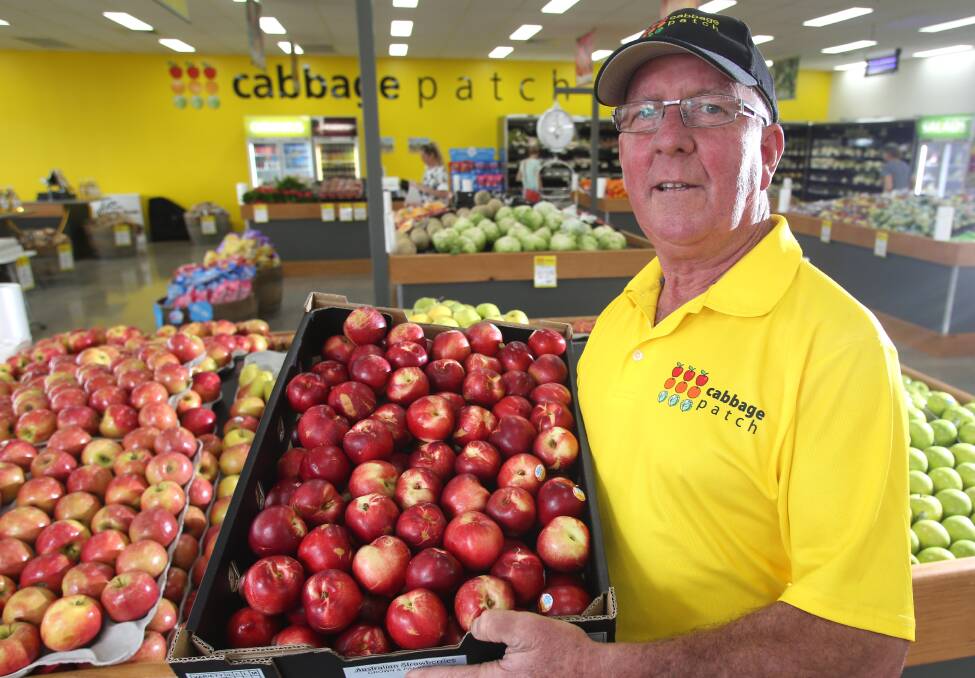 STONE COLD WINNERS: Fruiterer Les Dixon says stone fruit and pre-made salads would be in high demand for the festive season but there was one clear winner – 'it wouldn't be Christmas without cherries'. Picture: GLENN DANIELS