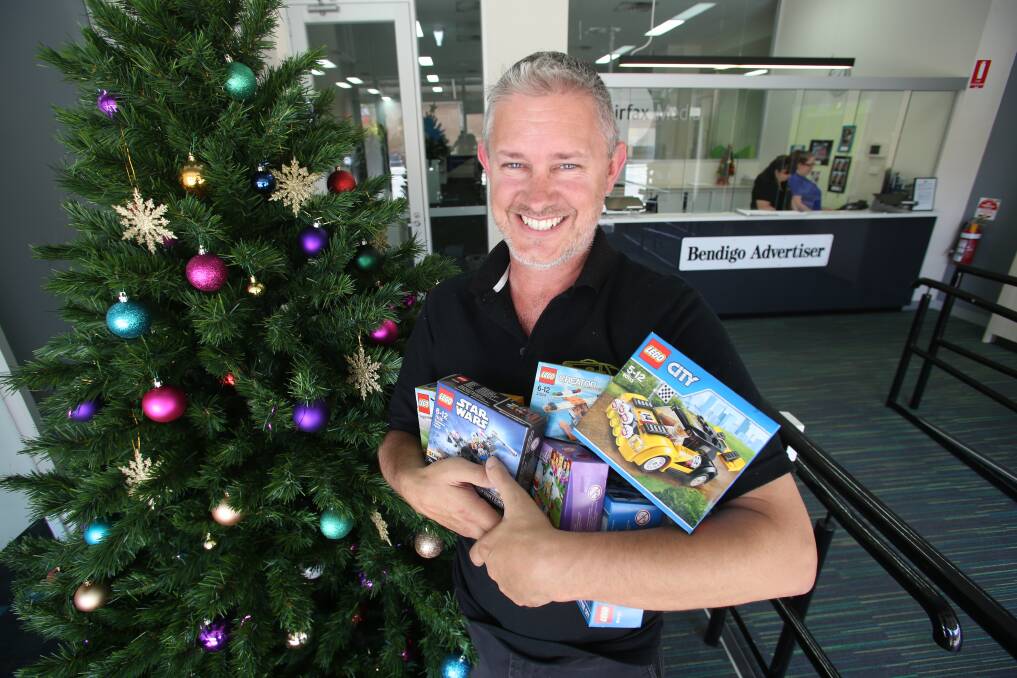 TIMELESS: Lego ambassador Michael Peebles brings the Bendigo Lego User Group donations to the Addy appeal – gifts can be dropped off at our Williamson Street office and will be distributed by St Vinnies. Picture: GLENN DANIELS