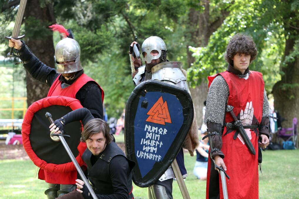 WEEKEND WARRIORS: David Brain, Cameron Turner, Noah Pinder and Simon Vincent put on a sword fighting performance at last weekend's Scots Day Out. Picture: GLENN DANIELS