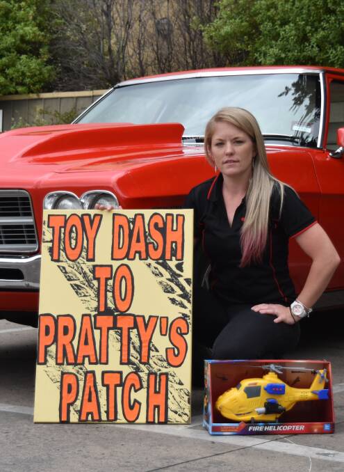 HELPING HAND: Toy dash organiser Melanie Tatt with her classic car.