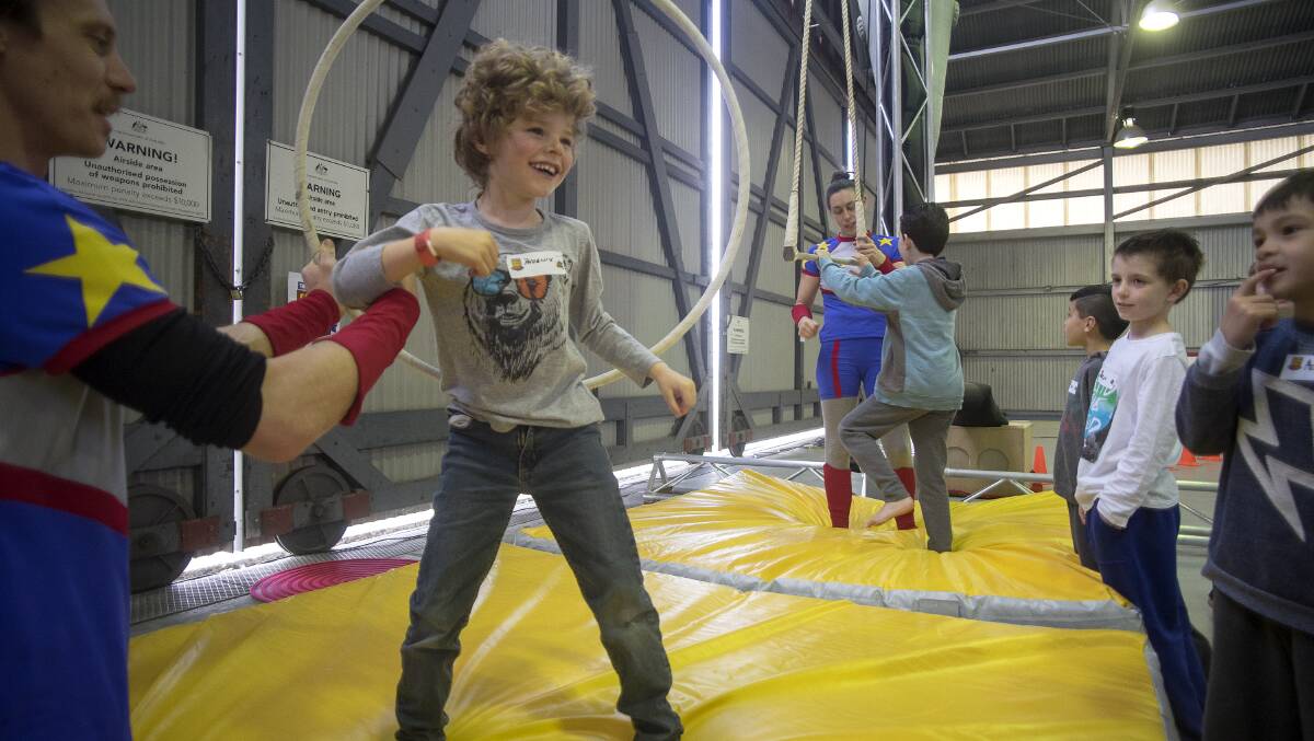 CONFIDENCE BOOSTER: Children take part on the Good Guys Super Hero Academy circus workshop in Melbourne. Picture: LUIS ASCUI
