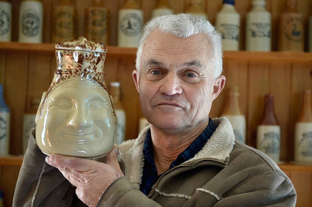 HOLY GRAIL: Kyneton collector Neville is determined to track down more of the striking Bendigo-made face jugs. Picture: NONI HYETT