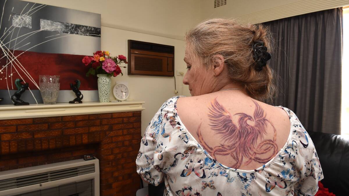 NEW BEGINNING: This tattoo of a phoenix marks a turning point in Carol Kane's life. Picture: NONI HYETT