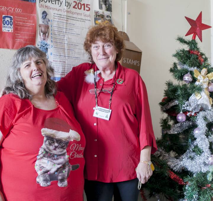 GENEROSITY: UnitingCare Bendigo Christmas program co-ordinators Julie Roberts and Angela Draper sort through this year's donations. Picture: CONTRIBUTED