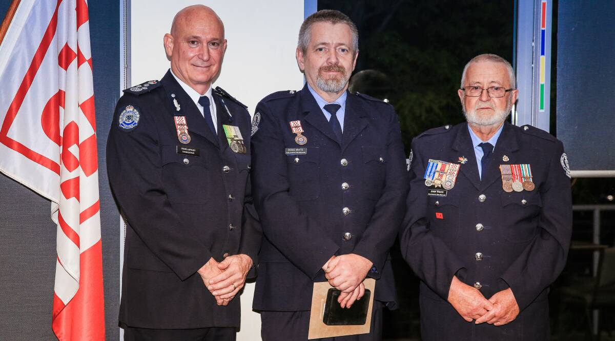 HONOUR: Emergency Services Commissioner Craig Lapsley (left) stands with Ross White (centre) and his father John White (right) at a recent presentation dinner.