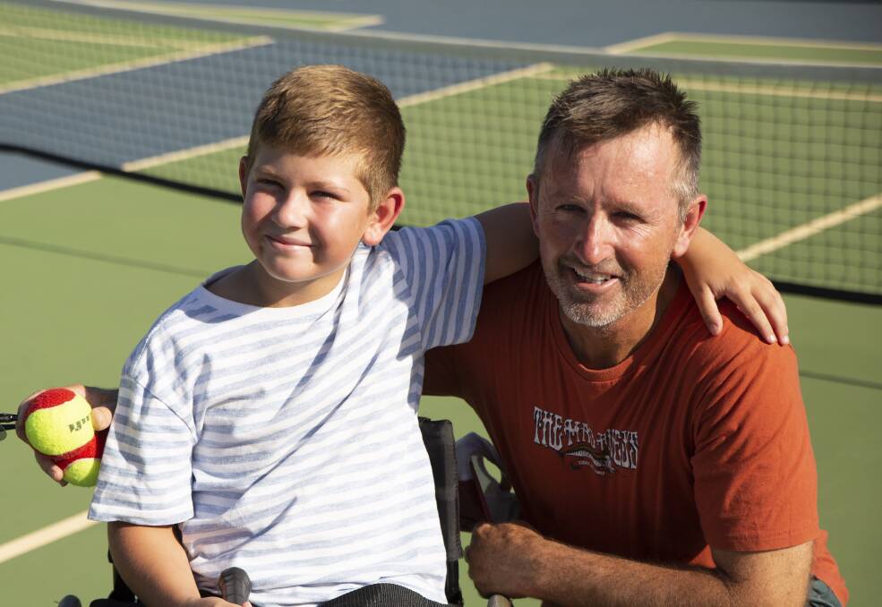 Chance Jones, pictured with dad Wayne at South Wagga Tennis Club, ahead of his first tennis lesson. Picture: Madeline Begley.