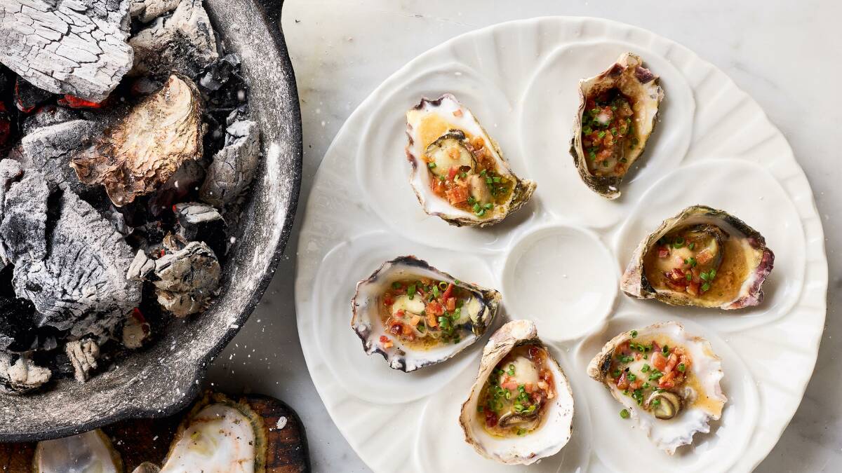 Coal-roasted oysters with bacon and devilled vinaigrette. Picture by Mark Roper