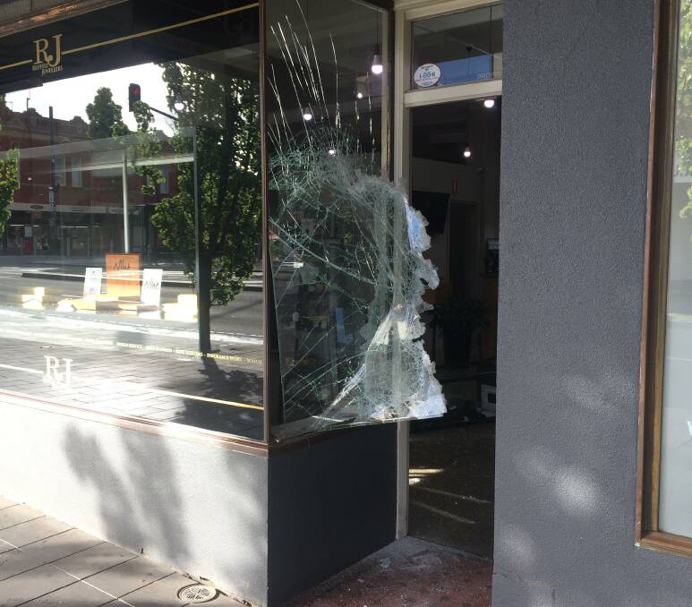 A smashed panel of glass at Ruffell Jewellers in central Bendigo. Picture: CHRIS PEDLER